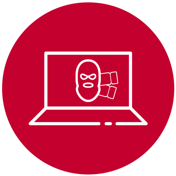 Imagen de la cara de un ciberdelincuente en la pantalla de un ordenador portátil