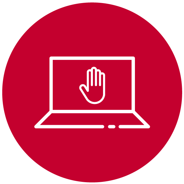 Portátil y mano en forma de stop en la pantalla
