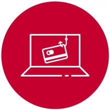 Ordenador portátil y en la pantalla un anzuelo con una tarjeta bancaria