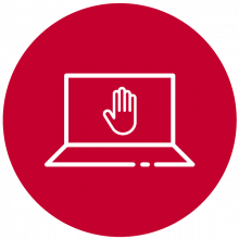 Portátil y mano en forma de stop en la pantalla